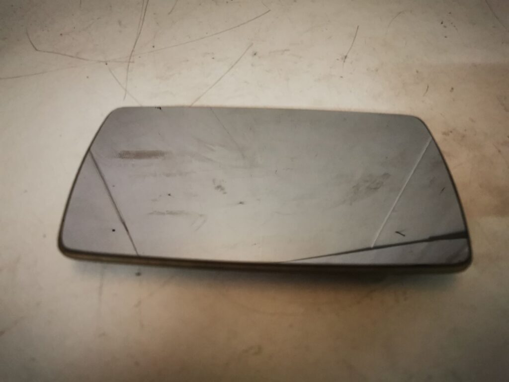 Cristal retrovisor izquierdo Ford Scort 91