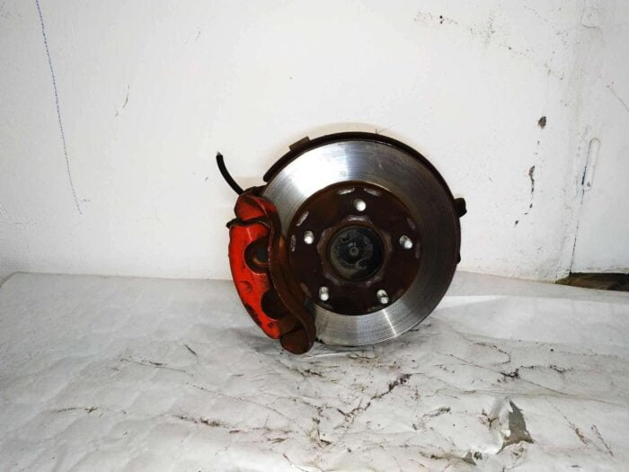 Mangueta con pinza y disco freno izq Nissan Vannette